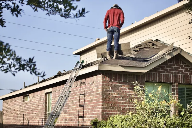 Professional roofer working on a residential roof in Skokie